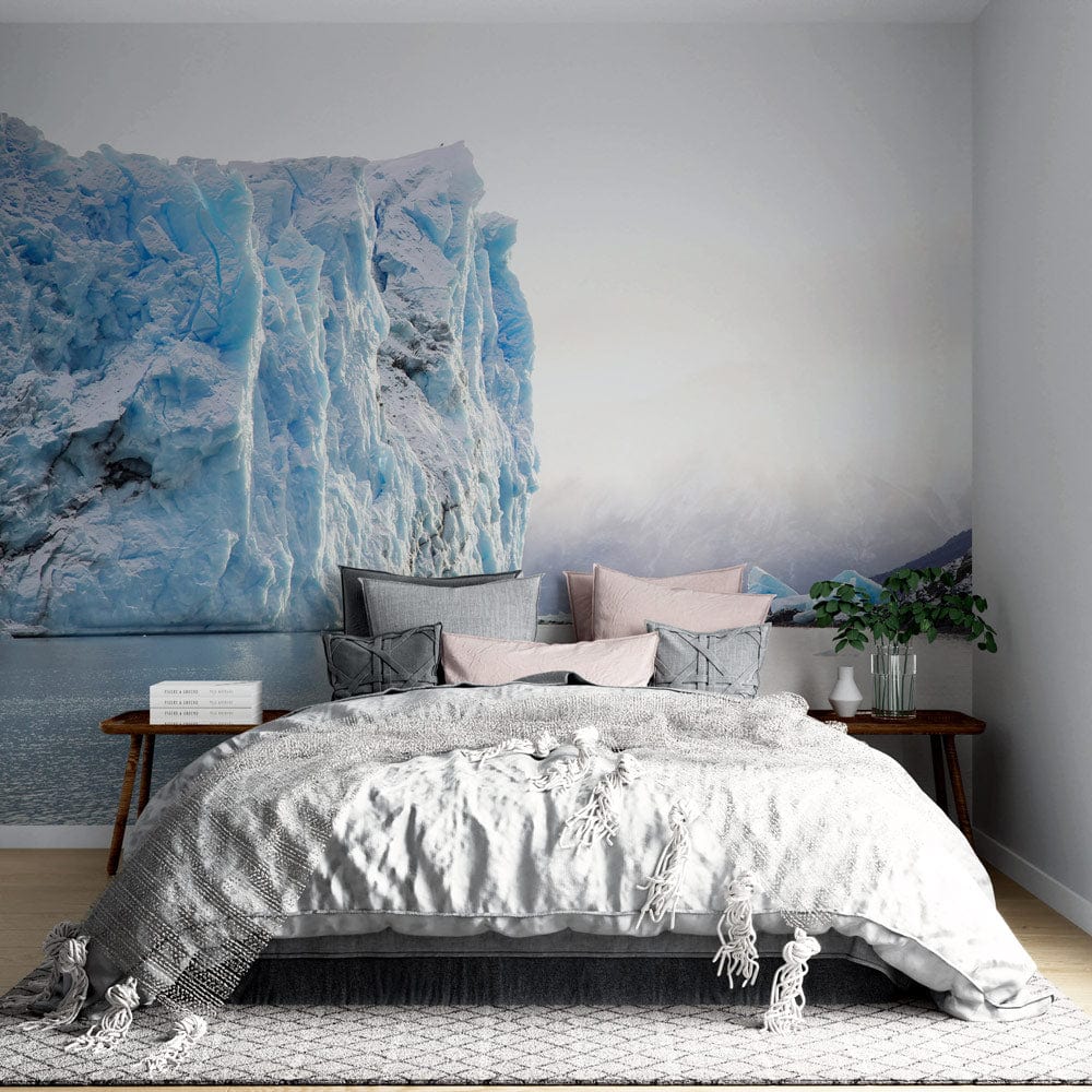 Serene room with glacier mural, grey bedding, wooden nightstand, and elegant interior decor elements.