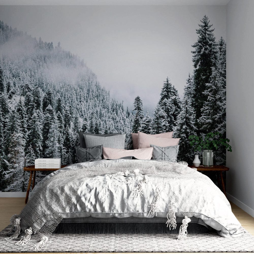 Winter forest mural wallpaper, monochrome style, bedroom setting, grey bedspread, wooden flooring, calming design.