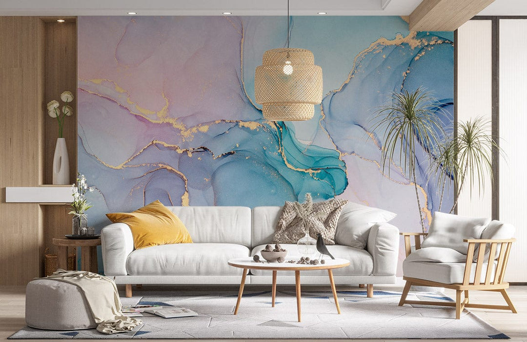 Elegant pastel watercolour mural with gold accents in minimalist living room; grey sofa, wooden accents.