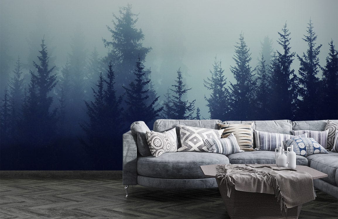 Mystical Misty Forest Mural Wallpaper features moody blue tones, grey sofa, and chevron-patterned flooring.