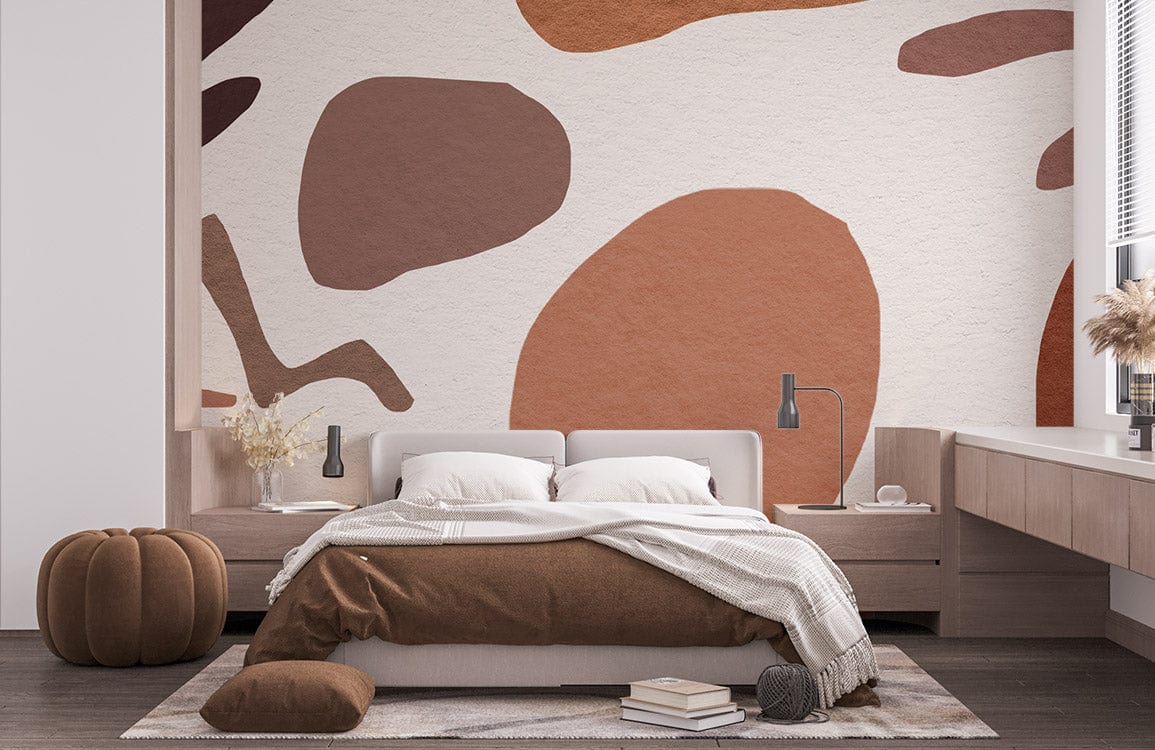Abstract Earthy Tones Scandinavian Mural Wallpaper in modern bedroom with brown sofa and wooden flooring.