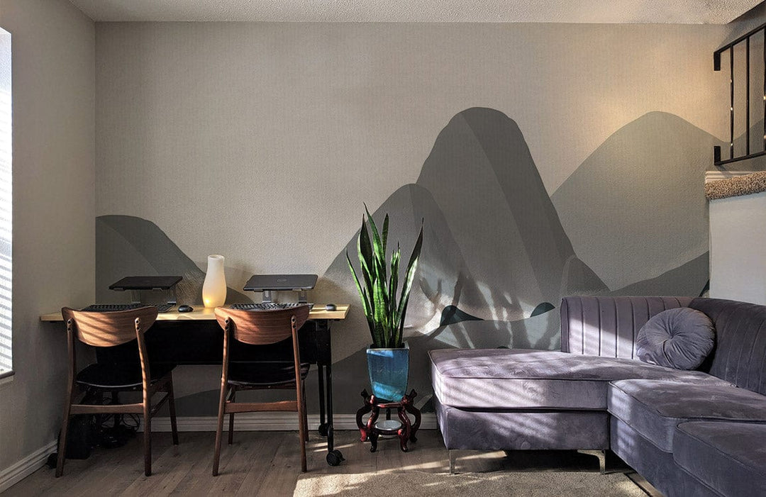 Modern living room with Tranquil Grey Mountain Mural; grey sofa, wooden flooring, minimalist design.
