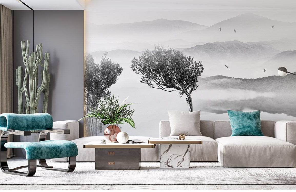 Serene Grey Mountain Mist Mural Wallpaper in modern living room with teal chairs, grey sofa, light flooring.
