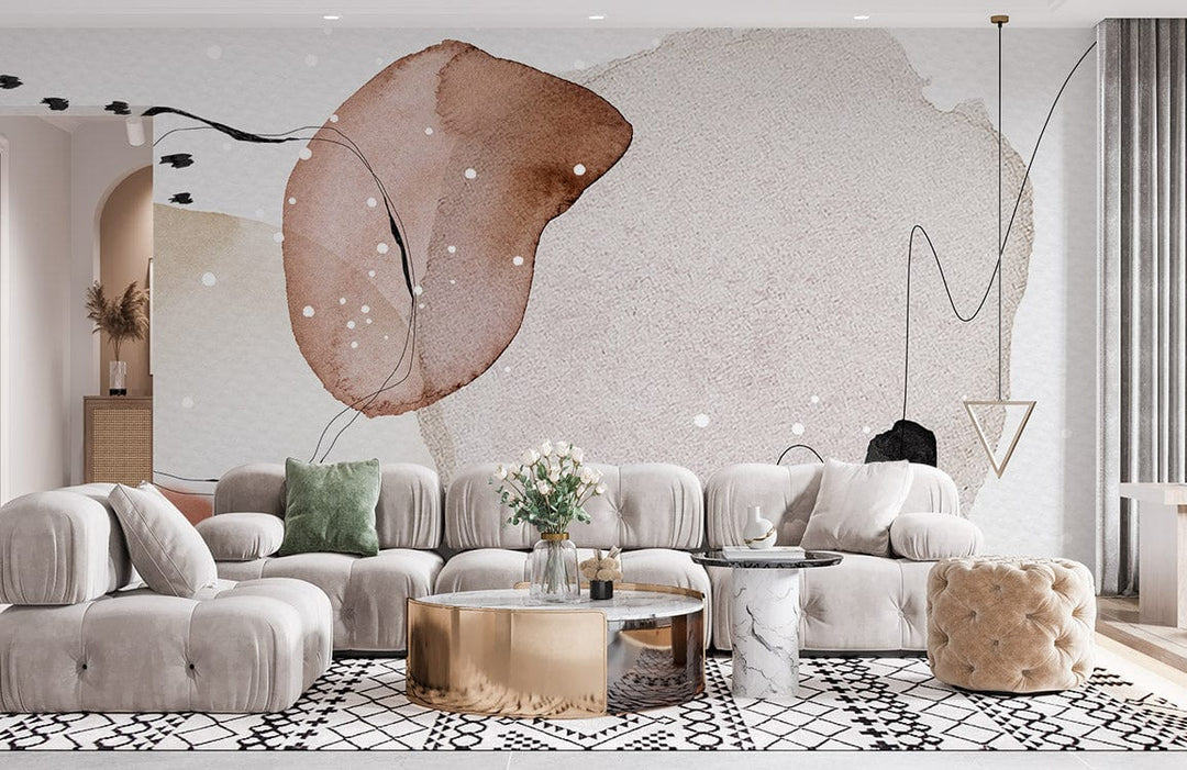 Modern lounge with abstract watercolour circles wallpaper, earthy tones; plush sofa, patterned rug, gold table.