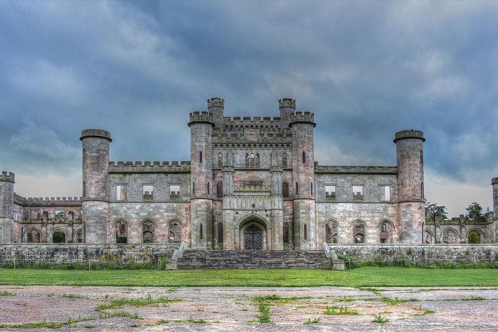 Majestic Stone Castle Mural Wallpaper in Moody Grey and Green Tones