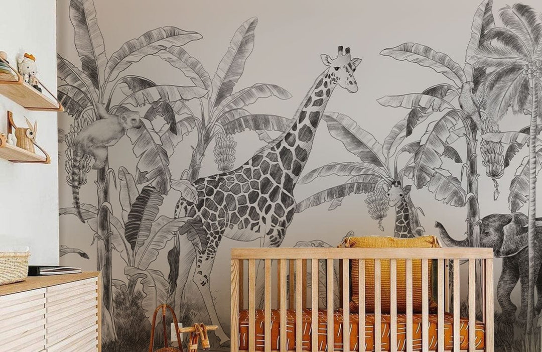 Vintage Safari Jungle Mural Wallpaper featuring giraffes with palm motifs in a stylish nursery setting.