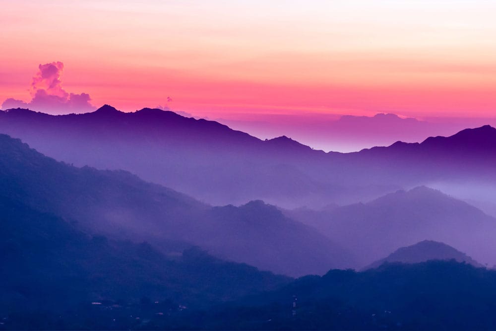 Tranquil Sunset Mountain Vista Wallpaper Mural: Purple and Pink Serenity Design