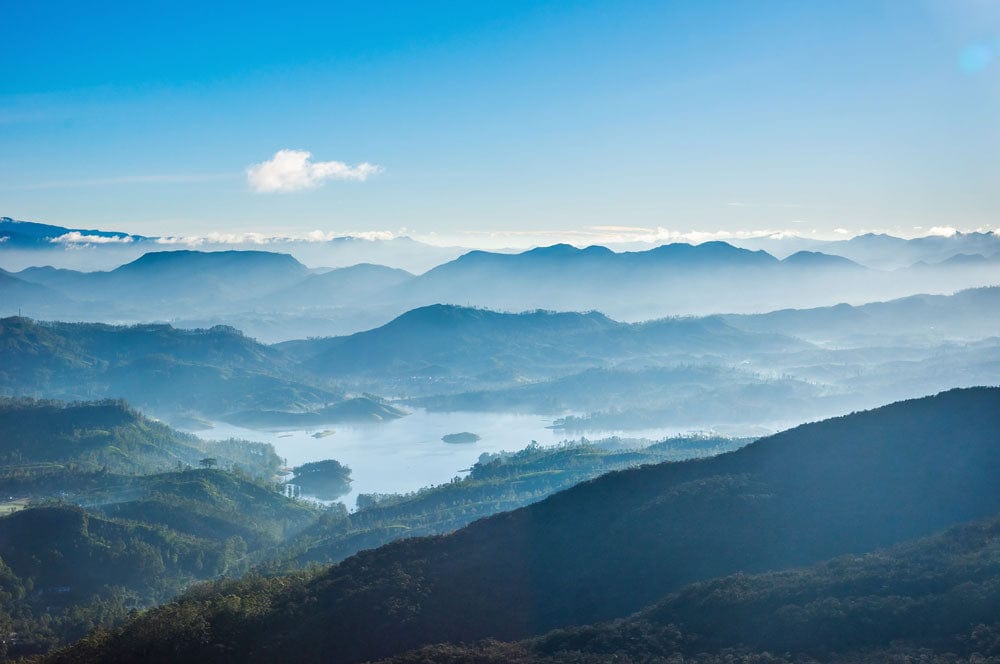 Serene Blue Misty Mountain Landscape Mural Wallpaper for Tranquil Spaces