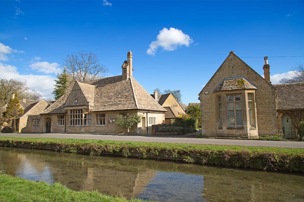 Charming Cotswold Village Scene Mural Wallpaper in Warm Stone Hues