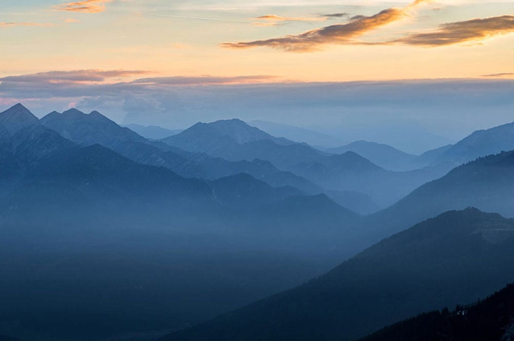 Tranquil Mountain Mist Mural Wallpaper in Blue Gradient Landscape Style