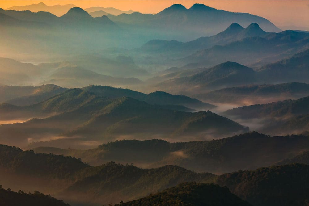 Serene Misty Mountain Landscape Mural Wallpaper in Tranquil Blue Green Hues