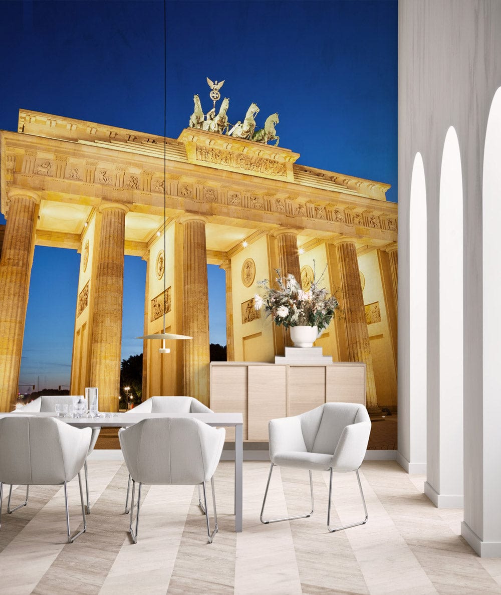 Brandenburg Gate mural in modern room with white chairs, wooden flooring, and elegant arch accents.