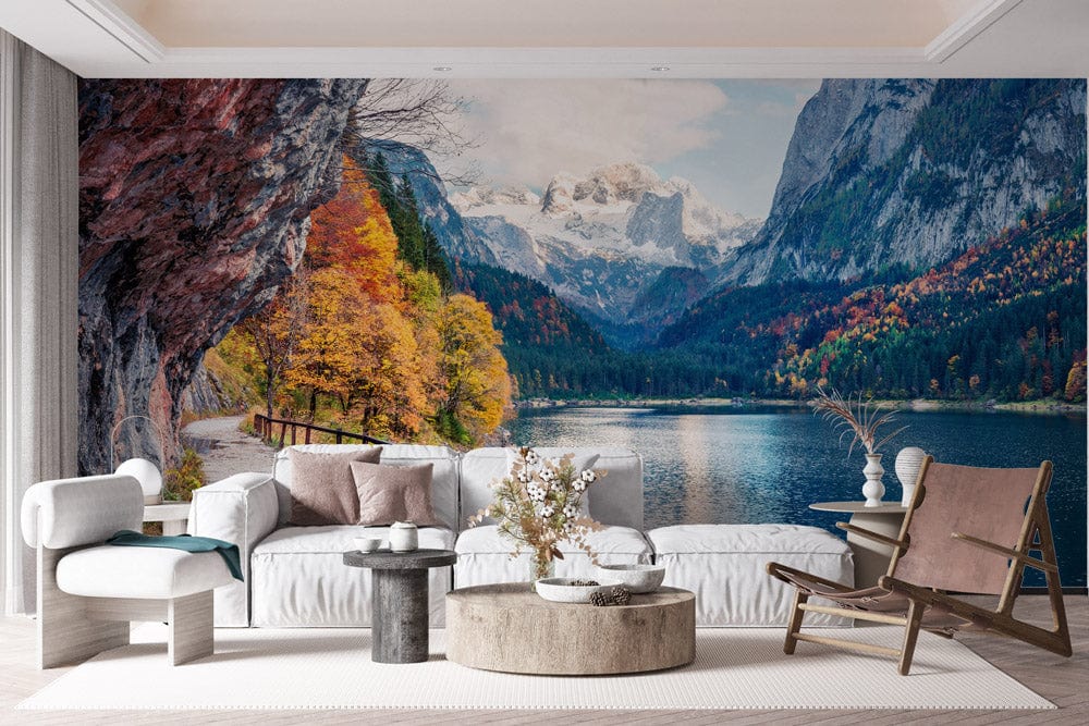 Modern living room with Mountain Lake Autumn Wonderland mural, vibrant colours, neutral sofas, round tables.
