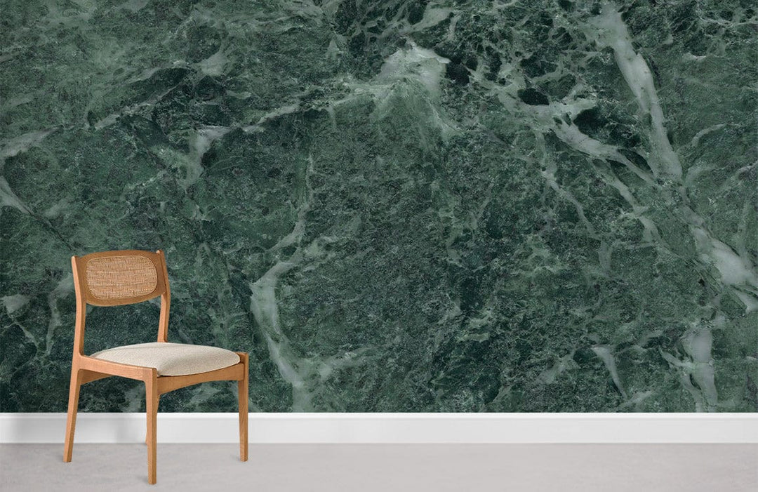 Luxurious green marble effect wallpaper with elegant stone texture, wooden chair, and neutral flooring.