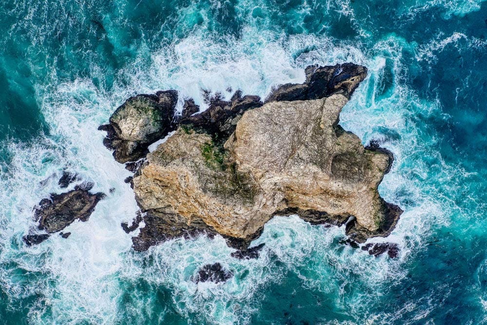 Aerial Coastal Rockscape Mural Wallpaper in Oceanic Blue and Granite Hues
