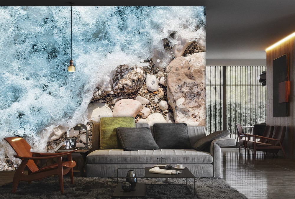 Coastal Serenity Ocean Mural Wallpaper in modern lounge with grey sofa, wooden chairs, and dark flooring.