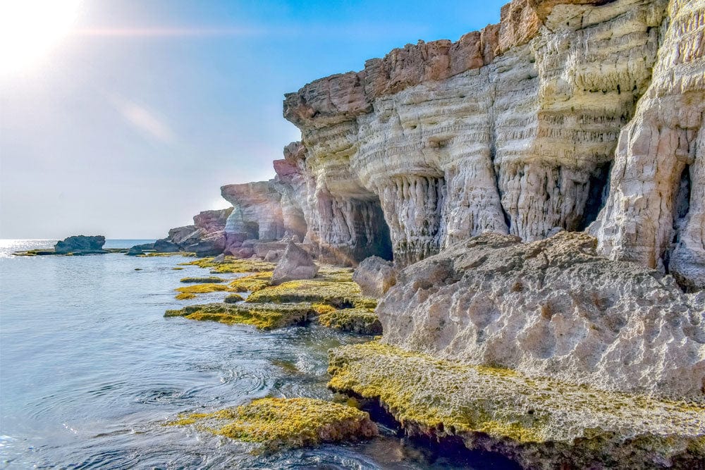 Coastal Cliff Serenity Mural Wallpaper: Tranquil Seaside Rock Formations Scene