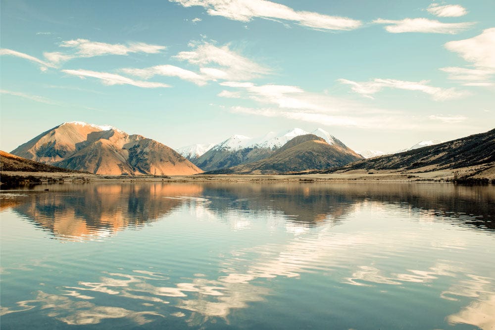 Tranquil Mountain Lake Mural Wallpaper in Serene Earthy Tones Scenic Design