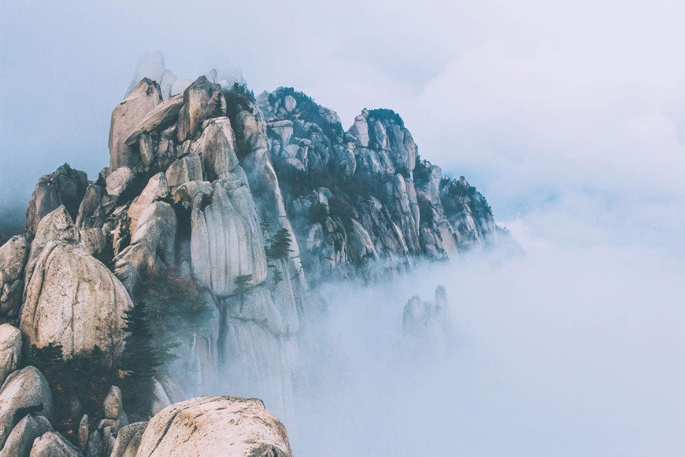 Serene Mountain Mist Mural Wallpaper: Tranquil Blue Grey Landscape Design