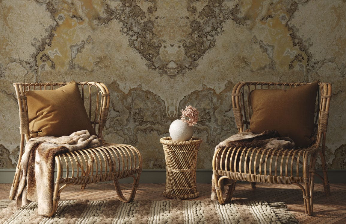 Beige and brown marble effect wallpaper with rattan chairs, wooden flooring, and cosy cushions.
