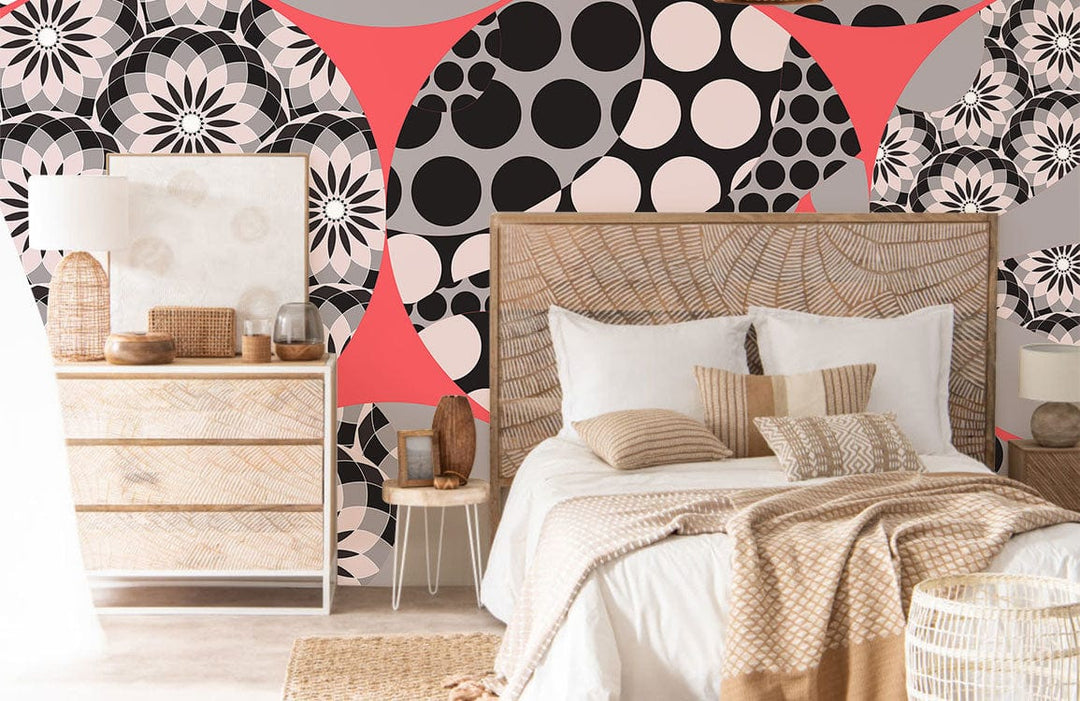 Retro Geometric Circles Wallpaper in pink, black, grey behind wicker bed, modern bedroom decor.