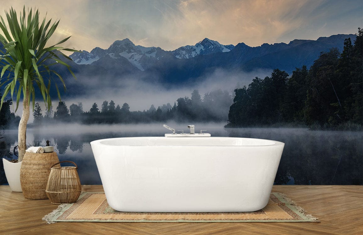 Serene Mountain Lake Reflection Mural Wallpaper with freestanding bathtub, herringbone flooring, and decorative plant.