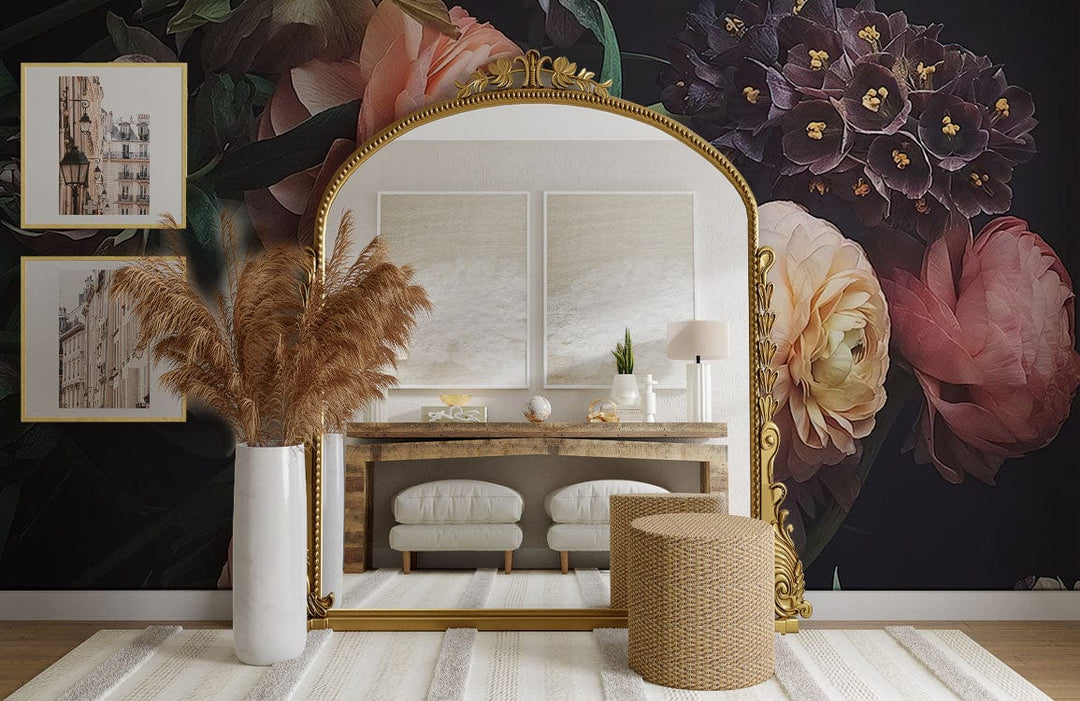 Vintage floral wallpaper with golden mirror, wooden console, white rug, and stylish stools in living room.