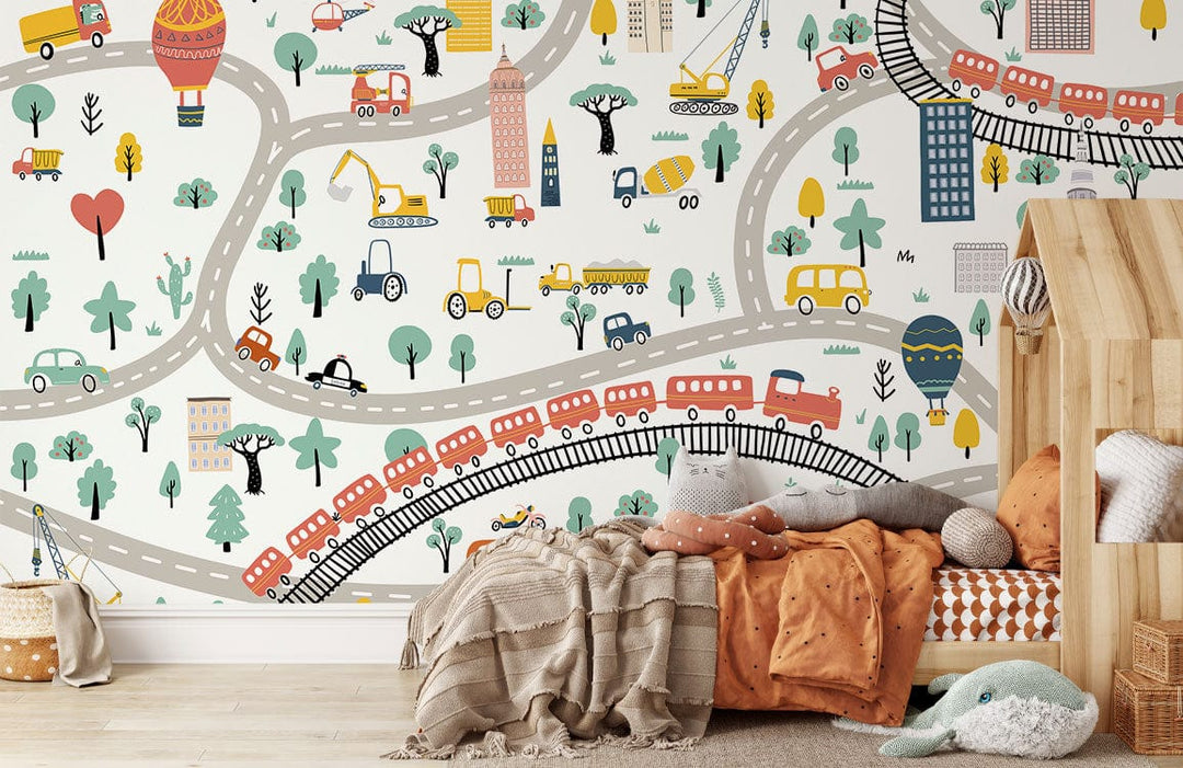 Children's room with Colourful City Adventure Wallpaper, playful roads, vehicles design, wooden bed, and cushions.