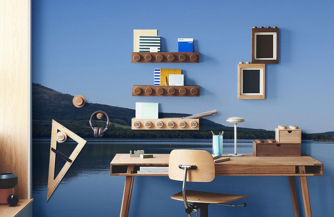 Tranquil Blue Lake Mural Wallpaper, wooden desk, geometric wall decor, modern study room design.