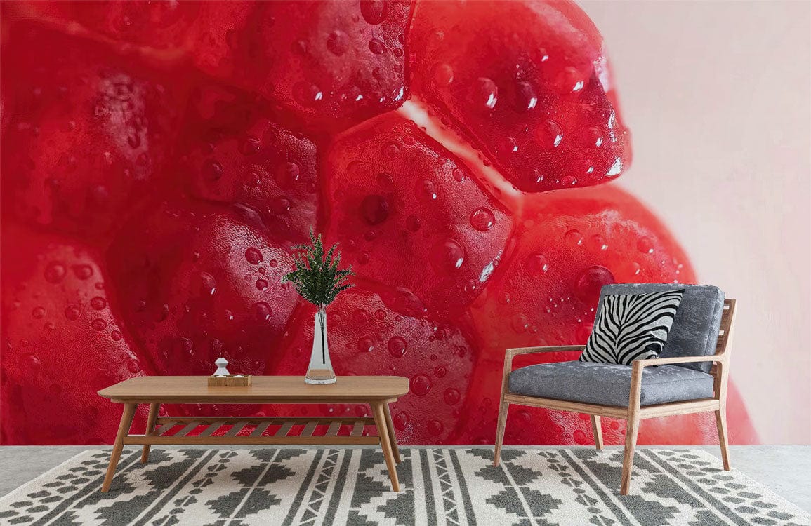 Modern lounge with vibrant pomegranate wallpaper, contemporary grey armchair, wooden table, geometric rug flooring.