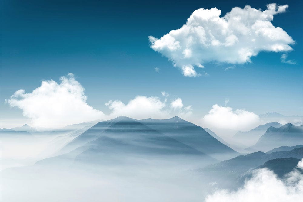 Serene Blue Mist Mountain Landscape Mural Wallpaper with Clouds Design