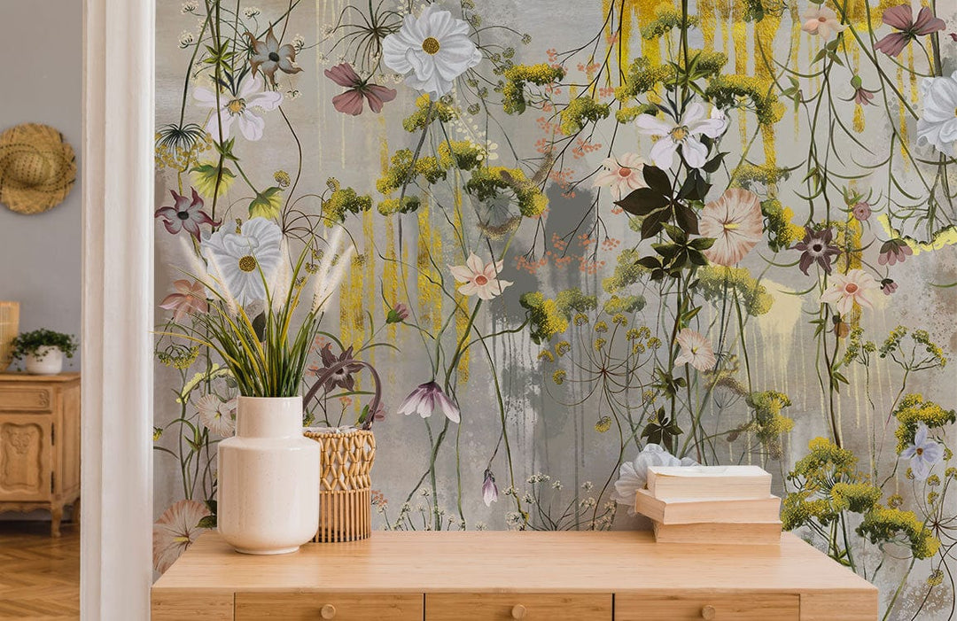 Elegant Floral Watercolour Mural Wallpaper in pastel hues, wildflowers, natural wood chest, rustic room.
