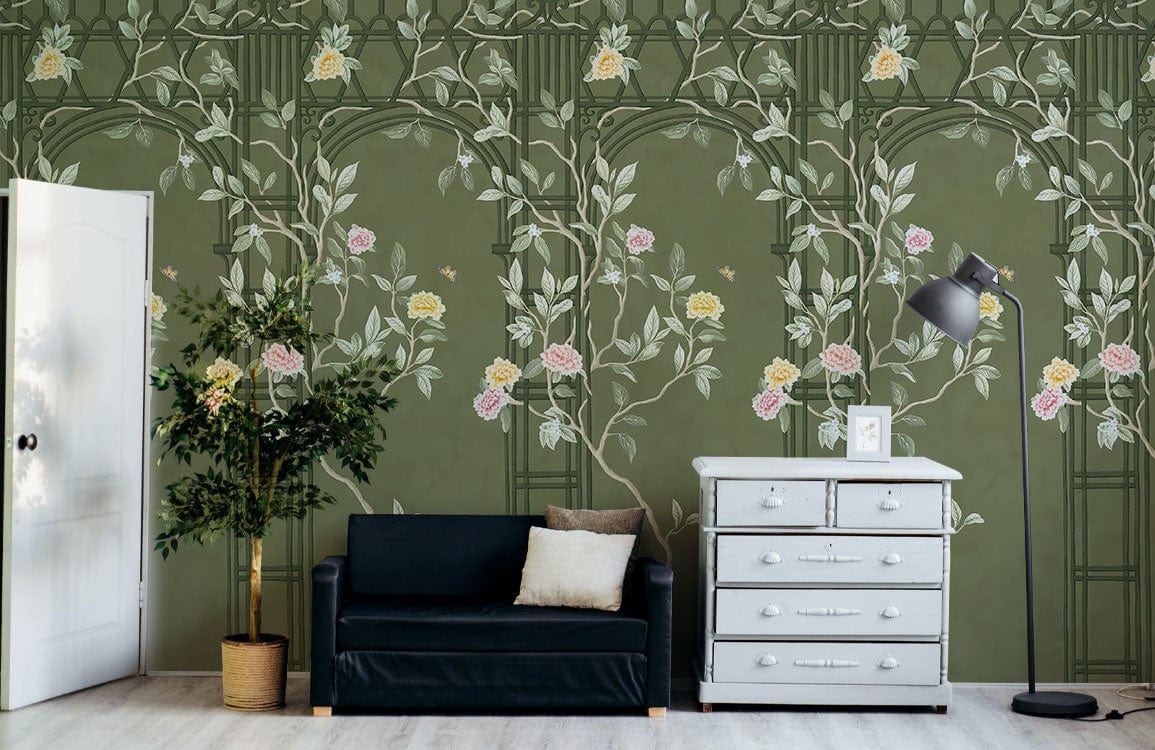 Vintage green botanical floral mural wallpaper, dark sofa, white chest of drawers, light flooring, standing lamp.