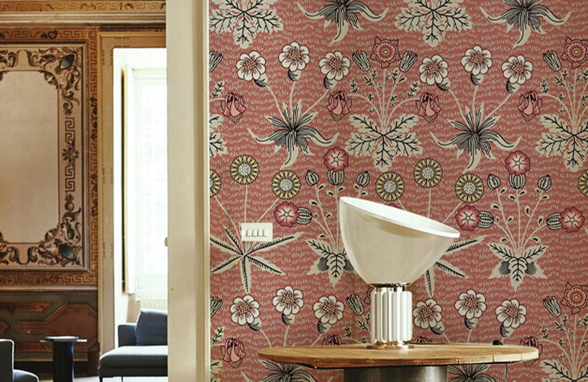 Vintage floral wallpaper with red, green design; elegant room setting with modern lamp on table.