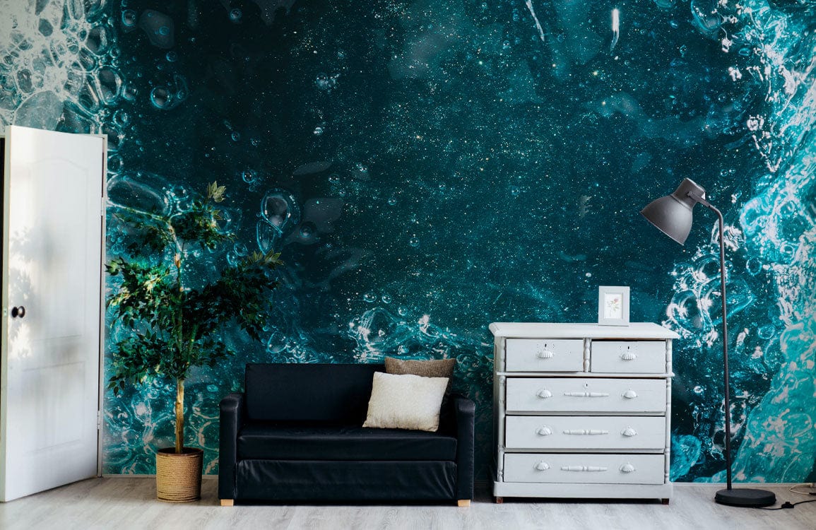 Oceanic teal abstract bubbles mural in living room with black sofa, white dresser, floor lamp.