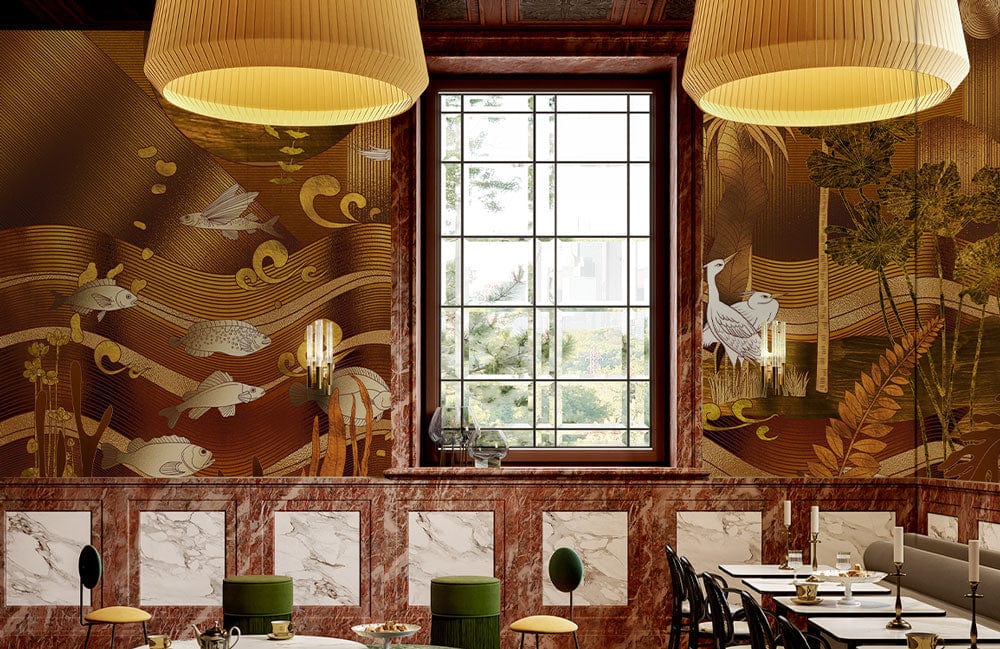Golden textured mural wallpaper featuring herons and fish in a sophisticated restaurant setting with chandeliers.