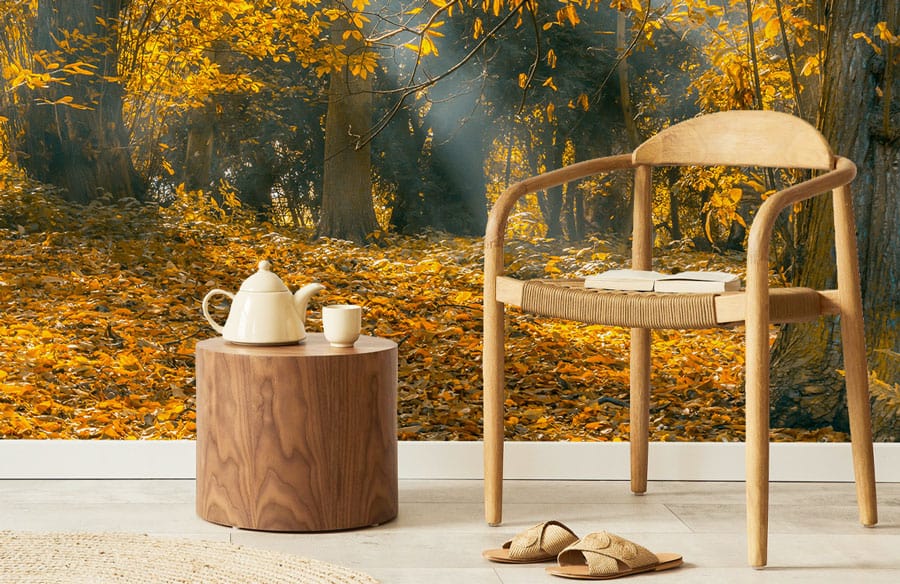 Autumn Radiance Forest Mural, golden woodland tones, wooden chair, round table, neutral flooring.