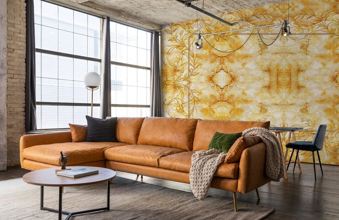 Golden Baroque Ornate Mural Wallpaper in living room, brown leather sofa, industrial lighting, carpet flooring.