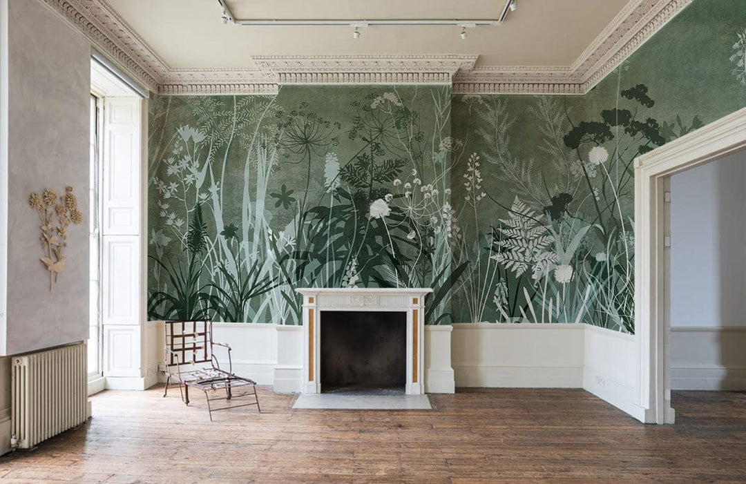 Botanical Forest Green Floral Mural Wallpaper in elegant nature pattern, with vintage fireplace, wooden floor.