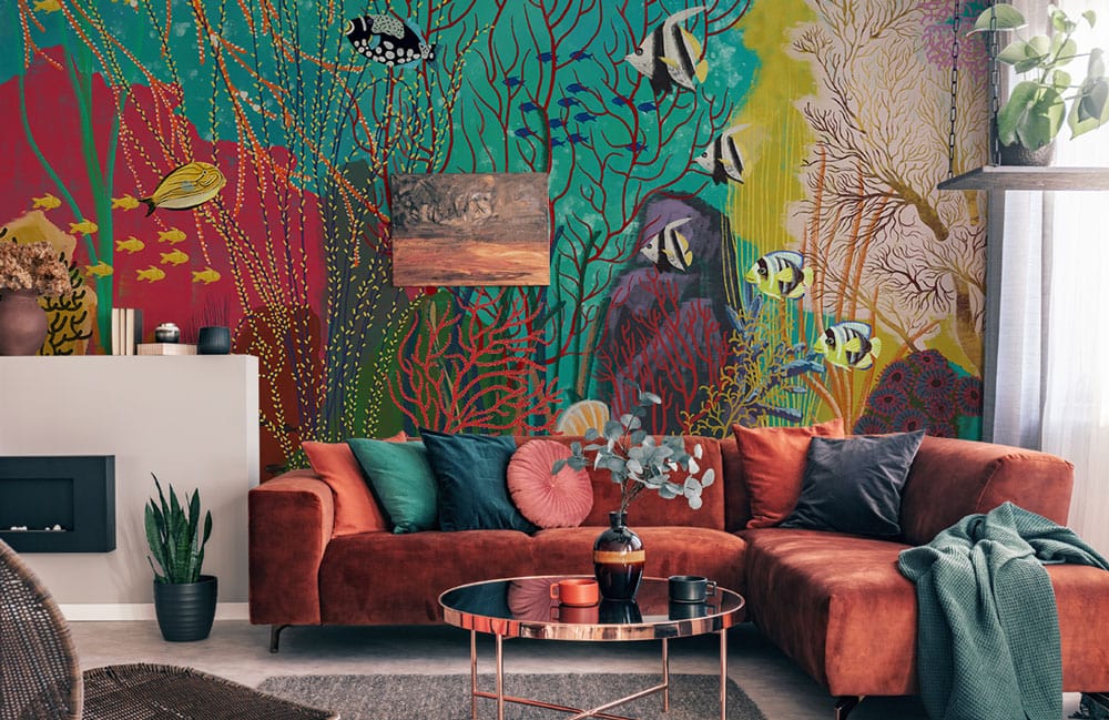Tropical Underwater Paradise mural wallpaper, vibrant coral reef, brown sofa, contemporary living room design.