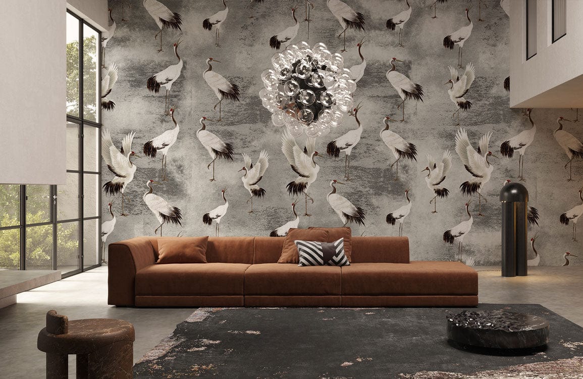 Elegant grey and white crane wallpaper, brown sofa, modern lighting, chic living room decor, textured flooring.