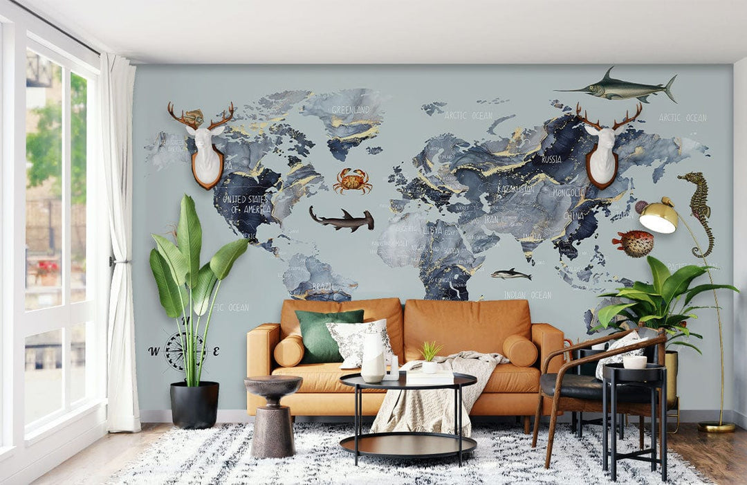 Nautical wall map mural, ocean animals, blue-grey; tan sofa, modern living room, patterned rug.