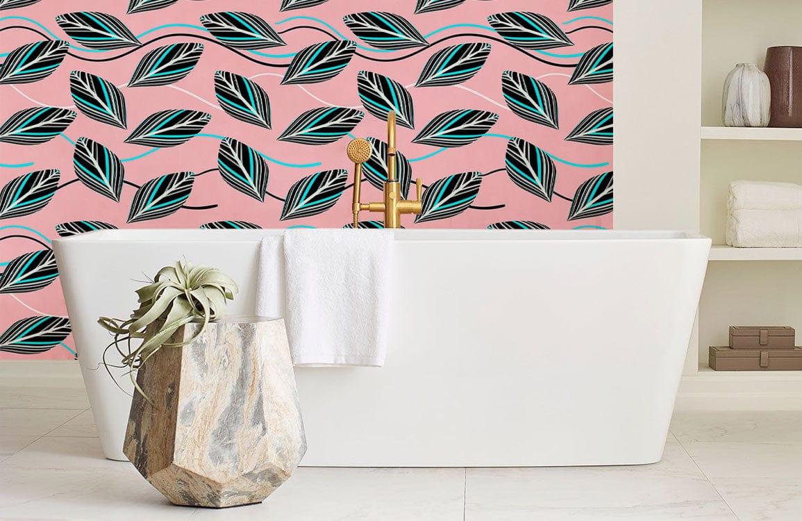 Blush pink Art Deco leaf wallpaper in bathroom with white freestanding bathtub and marble vase.