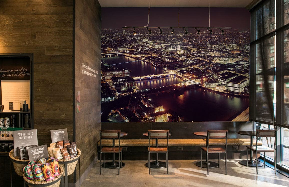 London night skyline mural wallpaper, modern café setting, wooden walls, concrete flooring, stylish seating.