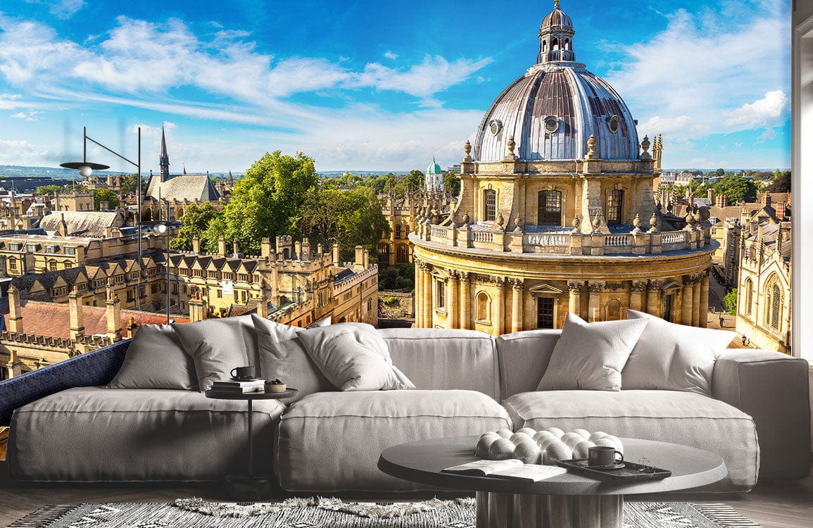 Luxurious living room with grey sofa, table, Oxford skyline mural wallpaper, classic architecture, blue sky.