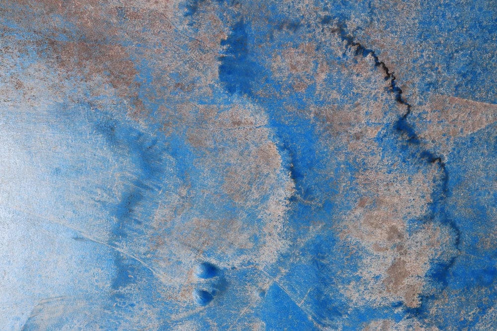 Abstract Blue and Earth Tones Textured Mural Wallpaper for Modern Spaces