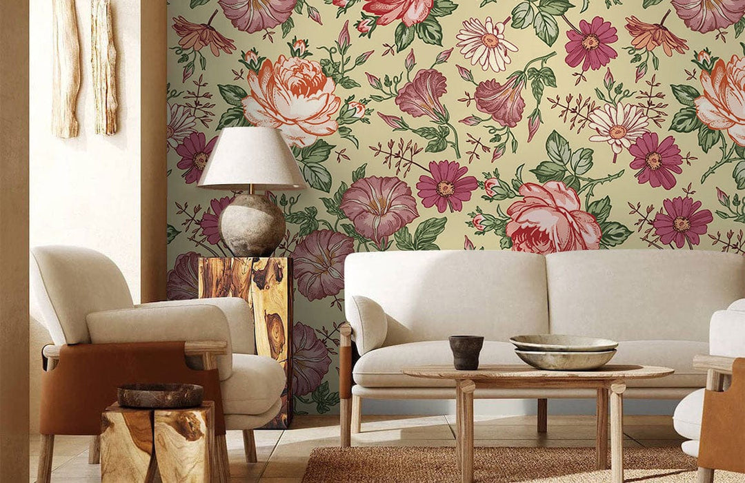 Vintage floral wallpaper with pastel roses, beige sofa, wooden flooring, and stylish table lamp.