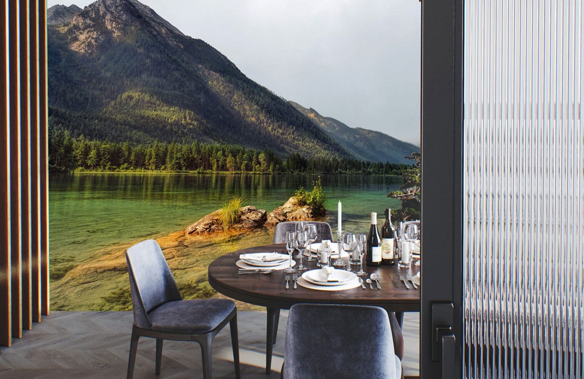 Dining area with Tranquil Mountain Lake Landscape Mural, grey velvet chairs, dark wood table setting.
