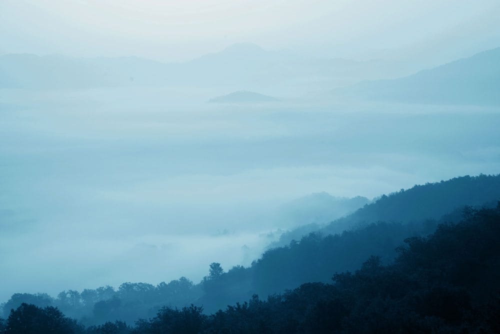 Tranquil Blue Mist Mountain Landscape Mural Wallpaper for Serene Interiors