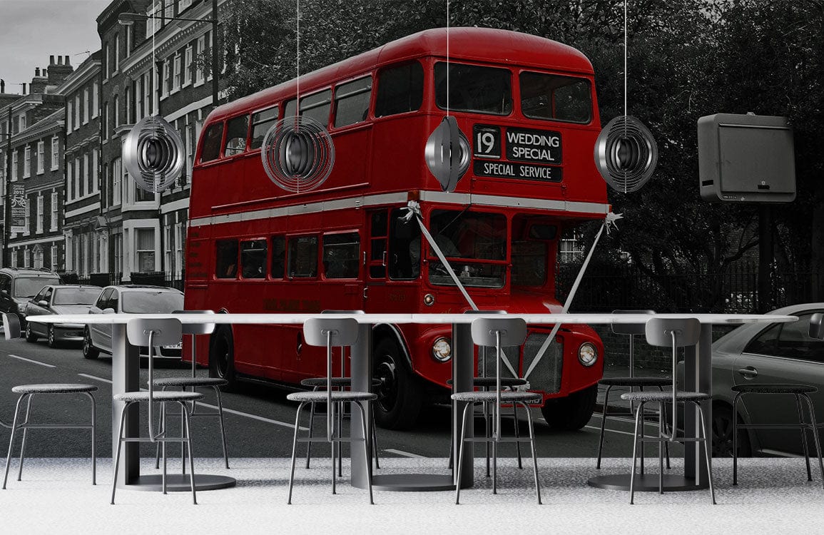 Vintage London red bus wallpaper in black-and-white urban street scene, modern bar stools, grey flooring.